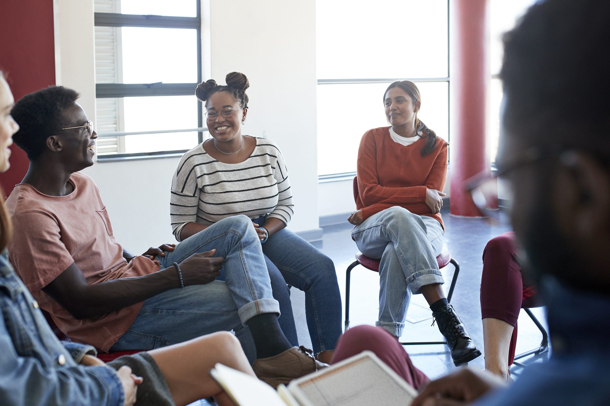 Adults struggling with co-occurring disorders participate in group therapy.